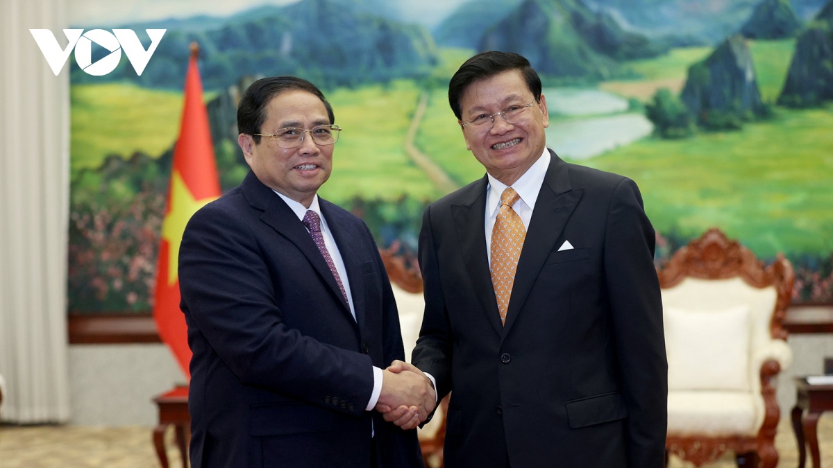 PM Chinh meets Party General Secretary, President, and NA Chairman of Laos